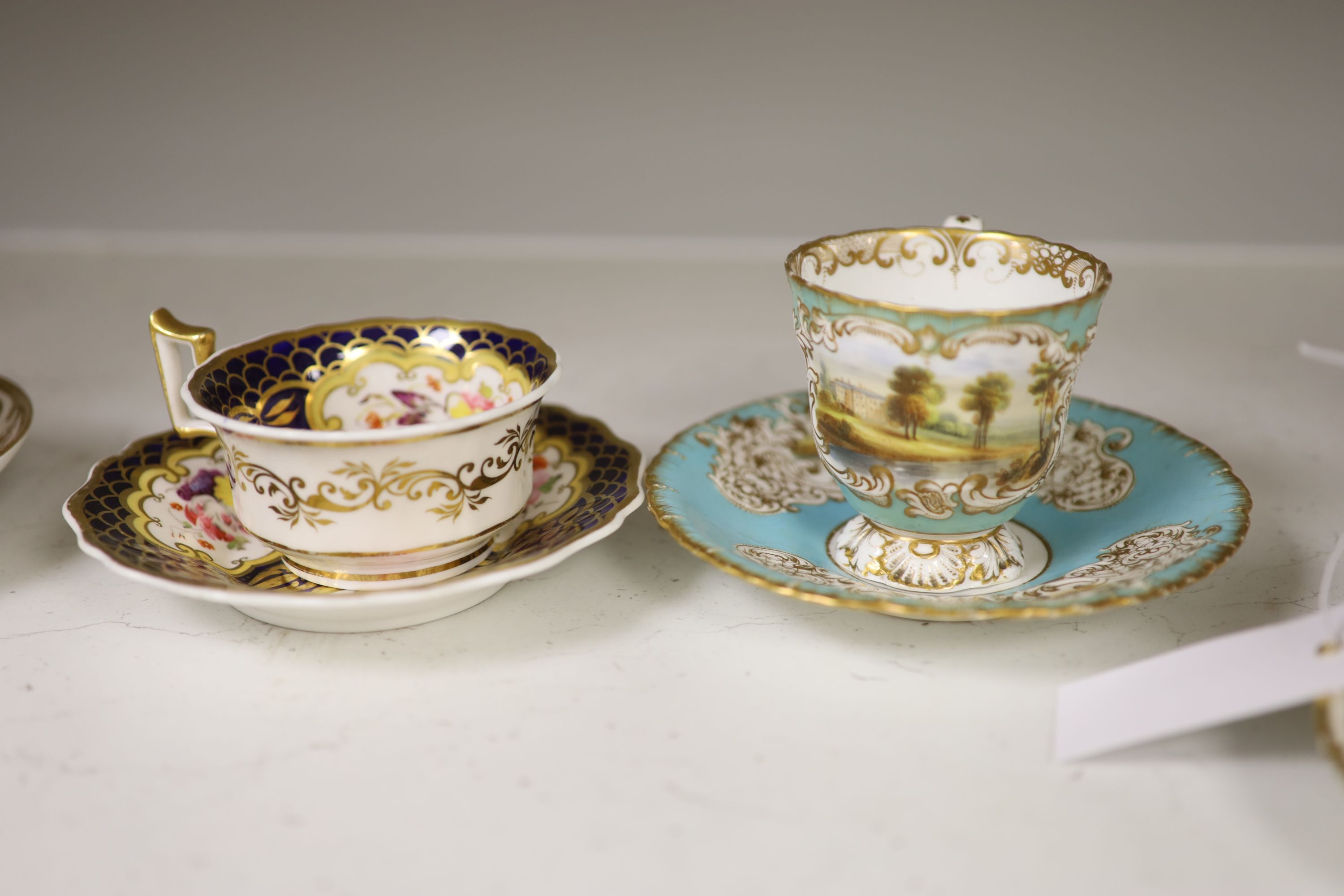 A Spode cup and saucer decorated with raised gilt birds and a basket with green leaves, marked Spode 3916, a Copeland and Garrett turqu